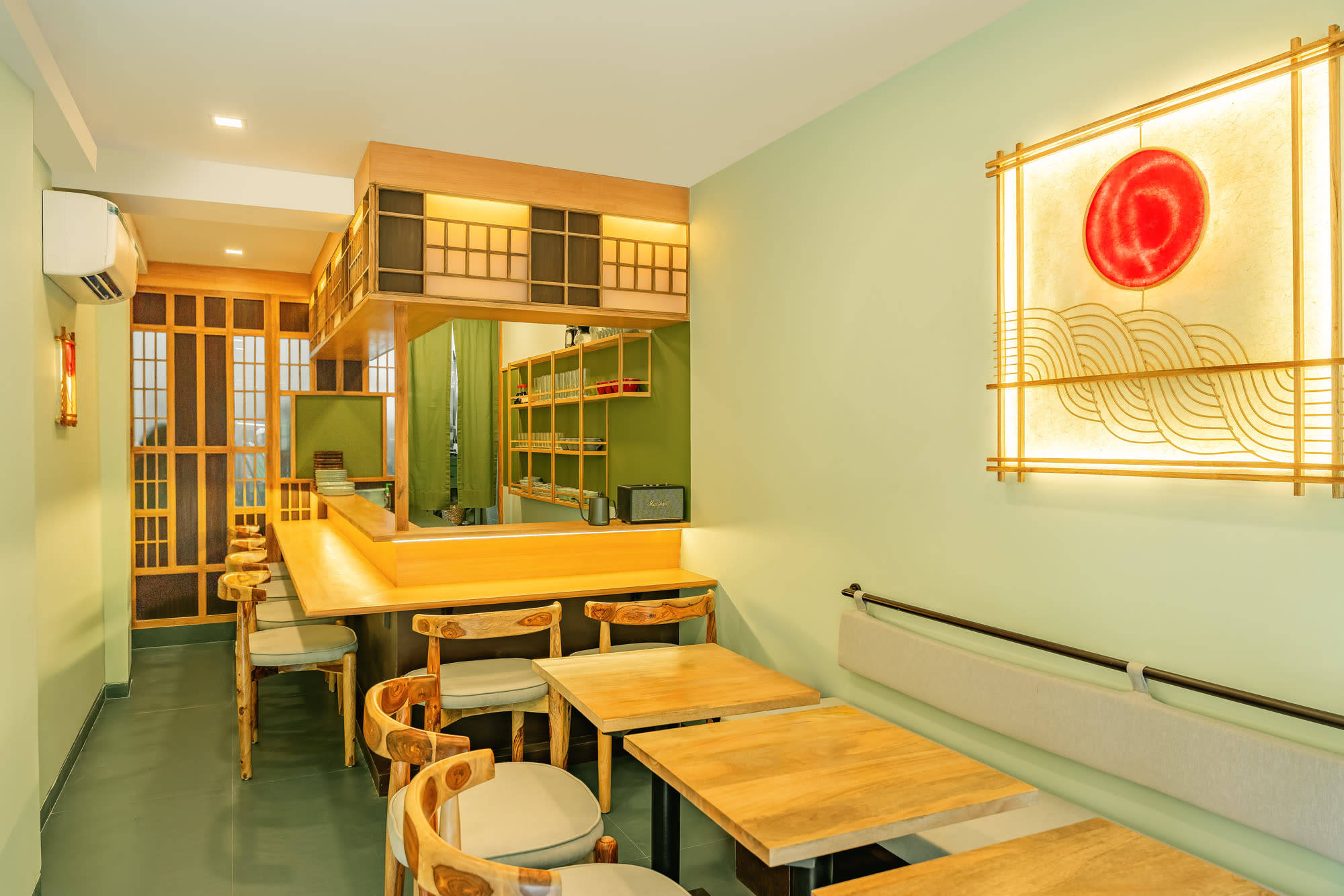 Counter seating and light wood tables at Abokado